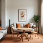 Petit salon et salle à manger réunis dans un appartement parisien moderne avec canapé en lin grège et table ronde en chêne